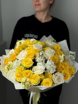 Bouquet of white garden roses and yellow spray roses