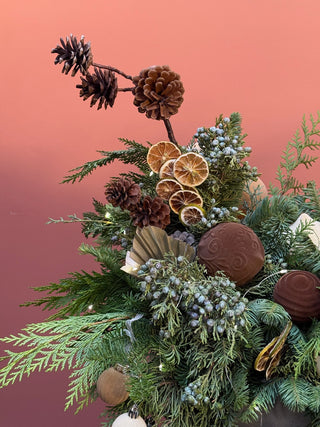 Christmas arrangement with velvet beige and brown ornament and preserved roses