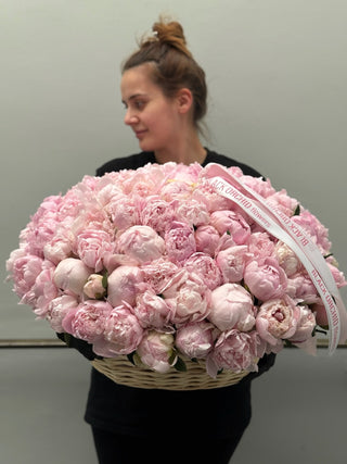 100 pink peonies in a basket