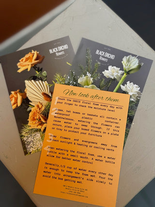 Christmas arrangement with velvet beige and brown ornament and preserved roses