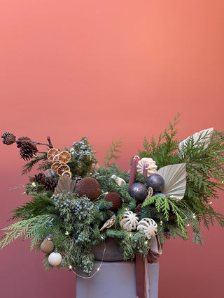 Christmas arrangement with velvet beige and brown ornament and preserved roses