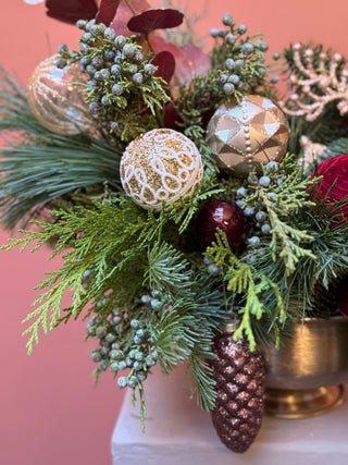 Red and gold Christmas arrangement in gold compote vase