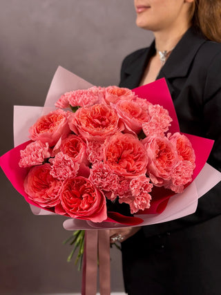 Bouquet of pink garden roses and pink dianthus