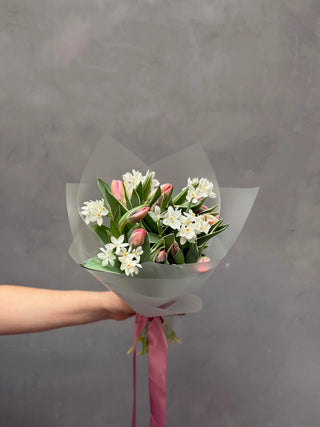 Bouquet of light pink tulips and white daffodils
