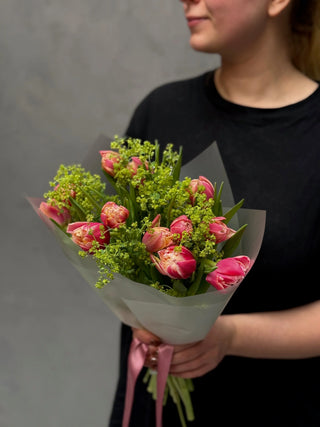 Bouquet of pink double tulips and alchemilla