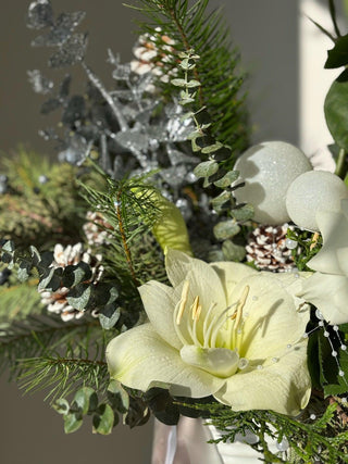 Christmas arrangement with garden roses and amaryllis