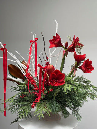 Christmas arrangement with red velvet bows