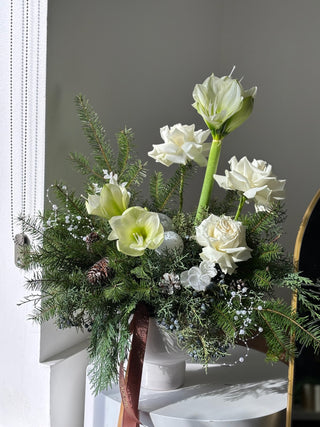 Christmas arrangement with garden roses and amaryllis