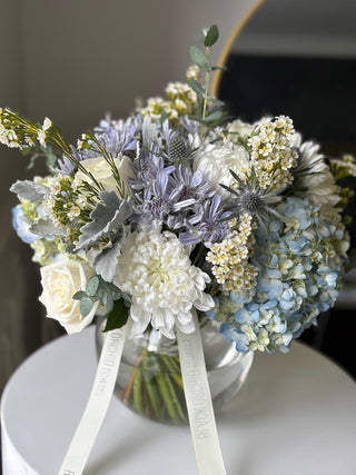 Blue and white flowers in a vase