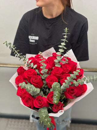 Dozen of red roses with eucalyptus