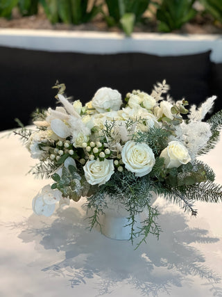 Classic Christmas arrangement with white roses and preserved decor