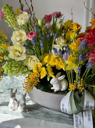 Easter centerpiece with tulips ranunculus and daffodil - Black Orchid Flowers